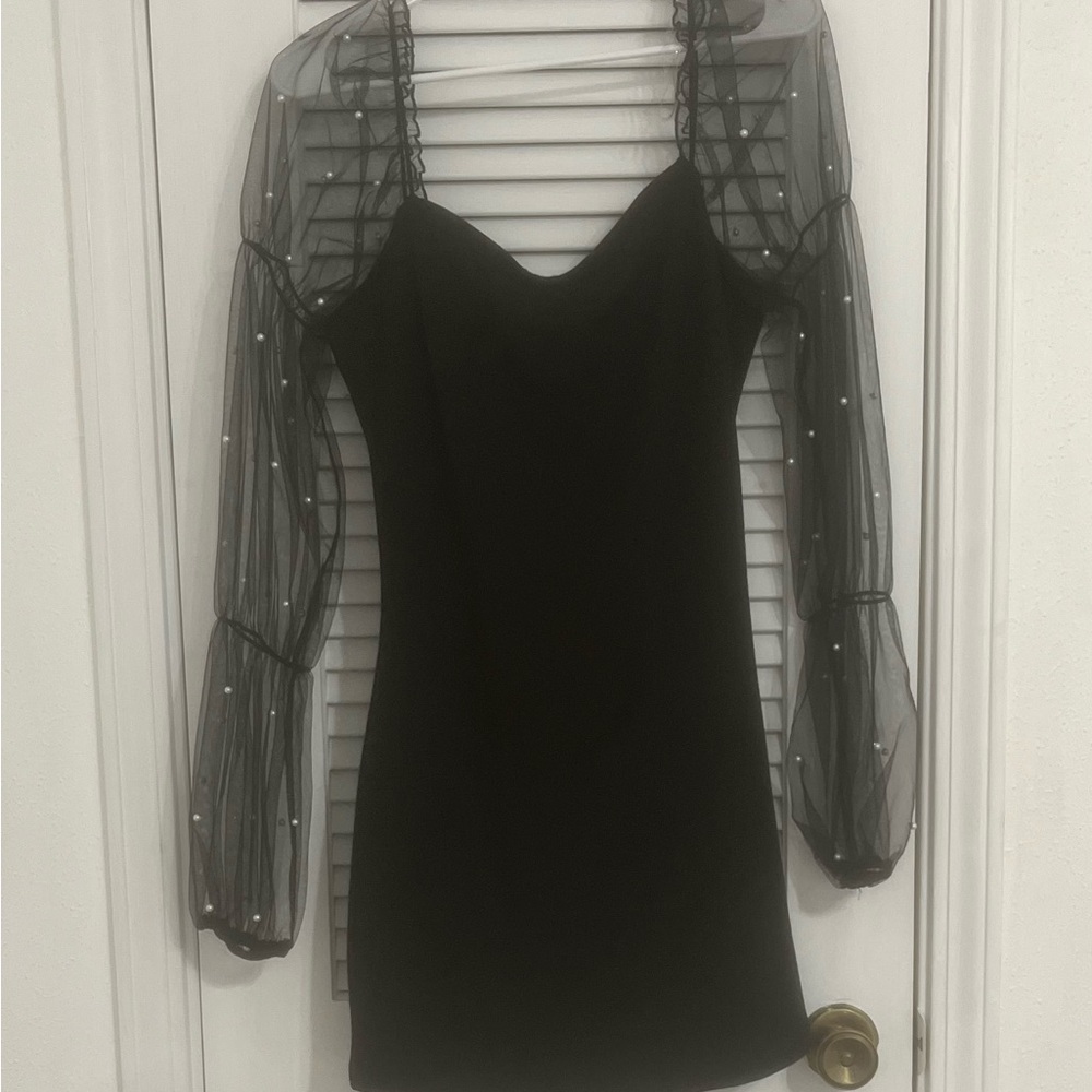black dress with pearls on sleeves.
